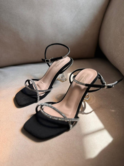 BLACK GLITTER TWISTED TRANSPARENT HEELS