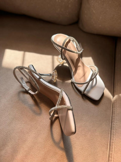 WHITE GLITTER TWISTED TRANSPARENT HEELS